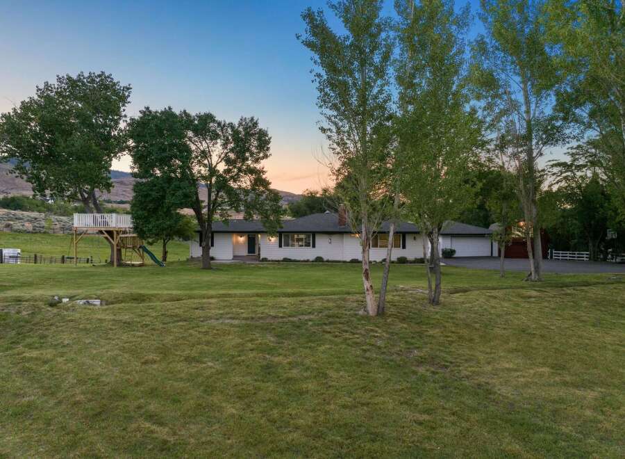 Discover this charming ranch-style home nestled on a sprawling property, perfect for outdoor enthusiasts.