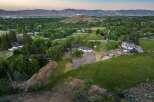 Discover this expansive property featuring a spacious home with multiple outbuildings, perfect for equestrian enthusiasts or those seeking ample storage.