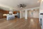 Experience modern living in this spacious open-concept home featuring a gourmet kitchen with rich wood cabinetry and a large island perfect for entertaining.