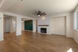 Experience modern living in this spacious open-concept home featuring a striking fireplace with shiplap accent and a rustic wood mantel.