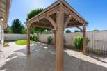 Enhance your outdoor living space with this stunning wooden gazebo, perfect for entertaining or relaxing.