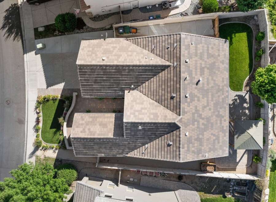 Experience luxury living in this stunning property, featuring a beautifully designed roofline that complements the home's architecture.