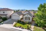Discover this charming single-story home featuring a beautifully manicured front lawn and a welcoming entryway.