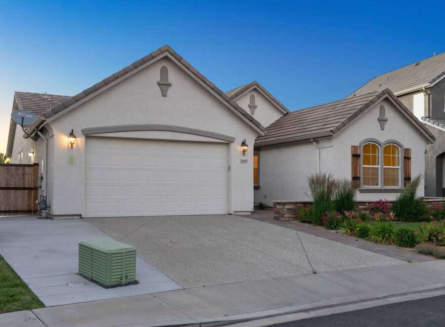 Discover this charming single-family home featuring a spacious two-car garage and a well-maintained driveway.