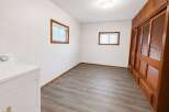 Discover this charming room featuring a convenient in-unit washer and dryer, perfect for modern living.
