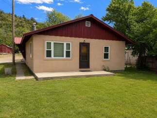 Charming single-family home nestled in a serene, natural setting.