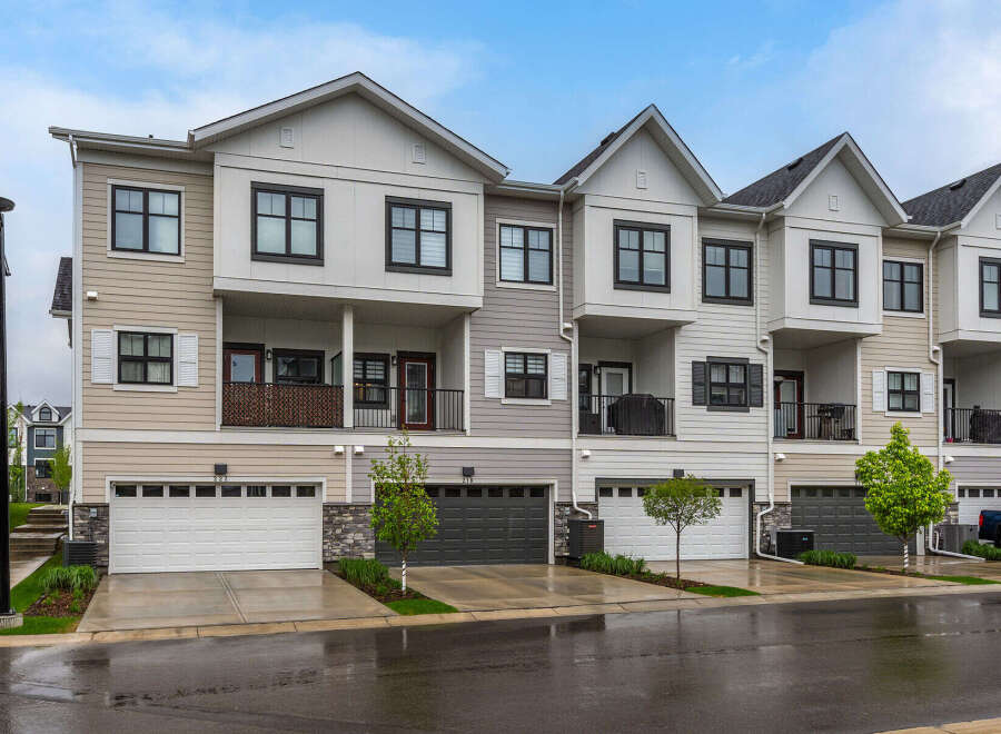 Discover modern townhome living with this stunning property featuring a multi-level design and attached garages.
