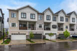 Discover modern townhome living with this stunning property featuring a multi-level design and attached garages.