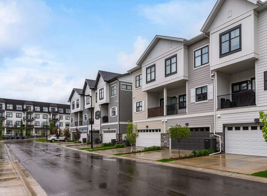 Discover modern townhome living in this stunning property featuring a row of contemporary multi-story residences.