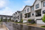 Discover modern townhome living in this stunning property featuring a row of contemporary multi-story residences.