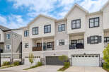 Discover modern townhome living with this stunning property featuring a sleek exterior and spacious multi-level design.