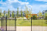 Discover modern living in this beautifully landscaped community, featuring stylish townhomes with elegant exteriors and manicured green spaces.