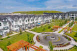 Discover modern living in this vibrant community featuring stylish townhomes and apartment buildings.