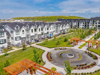 Discover modern living in this vibrant community featuring stylish townhomes and apartment buildings.