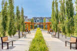 Discover modern living in this beautifully landscaped community, featuring elegant townhomes with striking architectural details.