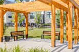 Enjoy outdoor living under this beautiful wooden pergola, perfect for relaxing or entertaining.