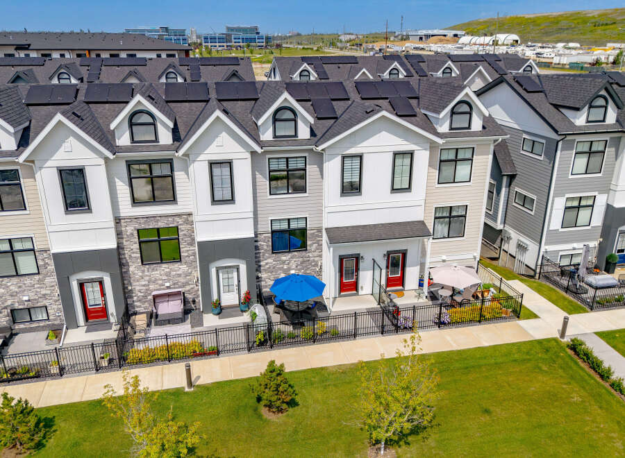 Discover modern townhome living with these stunning properties featuring sleek architectural design and energy-efficient solar panels.