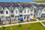 Discover modern townhome living with these stunning properties featuring sleek architectural design and energy-efficient solar panels.