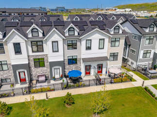 Discover modern townhome living with these stunning properties featuring sleek architectural design and energy-efficient solar panels.