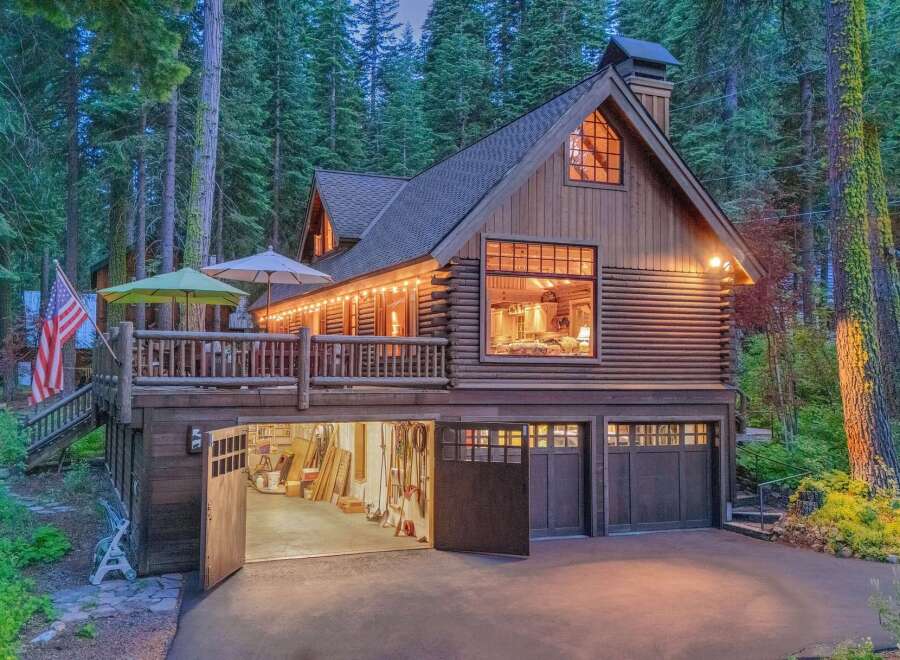 Experience rustic charm in this stunning log cabin nestled amongst towering trees.