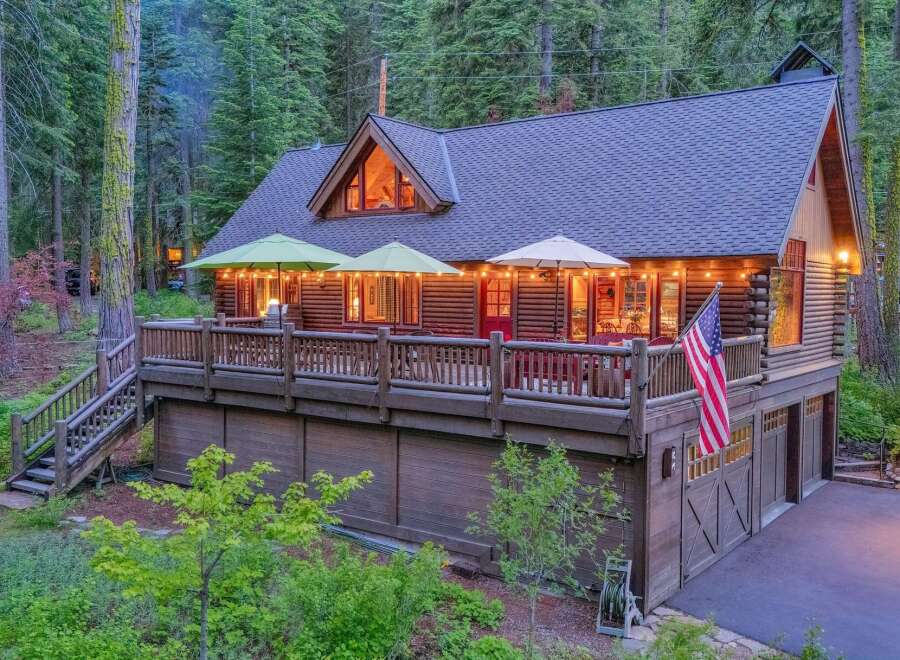 Experience rustic charm in this stunning log cabin nestled amidst a serene forest.