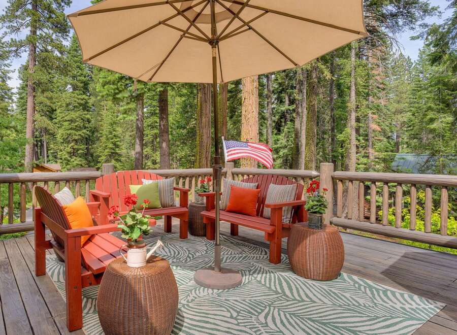 Enjoy the serene mountain setting from this charming deck, perfect for outdoor relaxation.