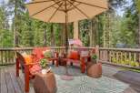 Enjoy the serene mountain setting from this charming deck, perfect for outdoor relaxation.