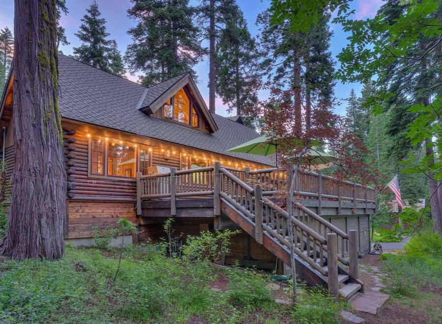 Experience rustic charm in this stunning log cabin nestled amongst towering trees.