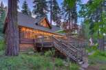 Experience rustic charm in this stunning log cabin nestled amongst towering trees.