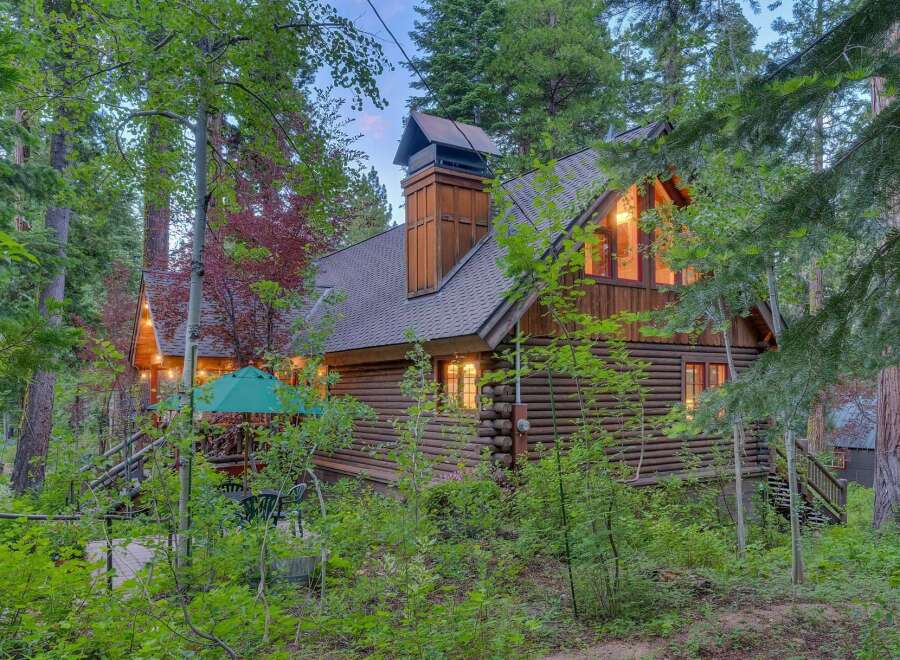 Nestled amidst lush greenery, this charming log cabin offers a serene retreat.