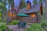 Experience rustic charm in this log cabin nestled amongst tall trees.