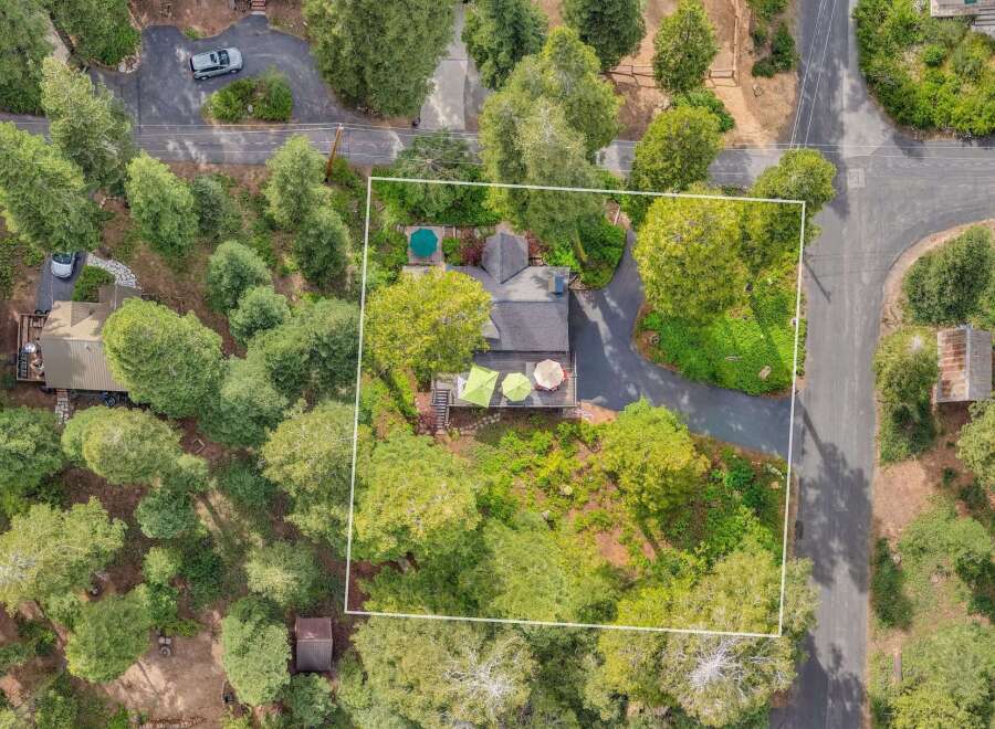 Discover this charming property nestled amongst mature trees, offering a private and serene retreat.