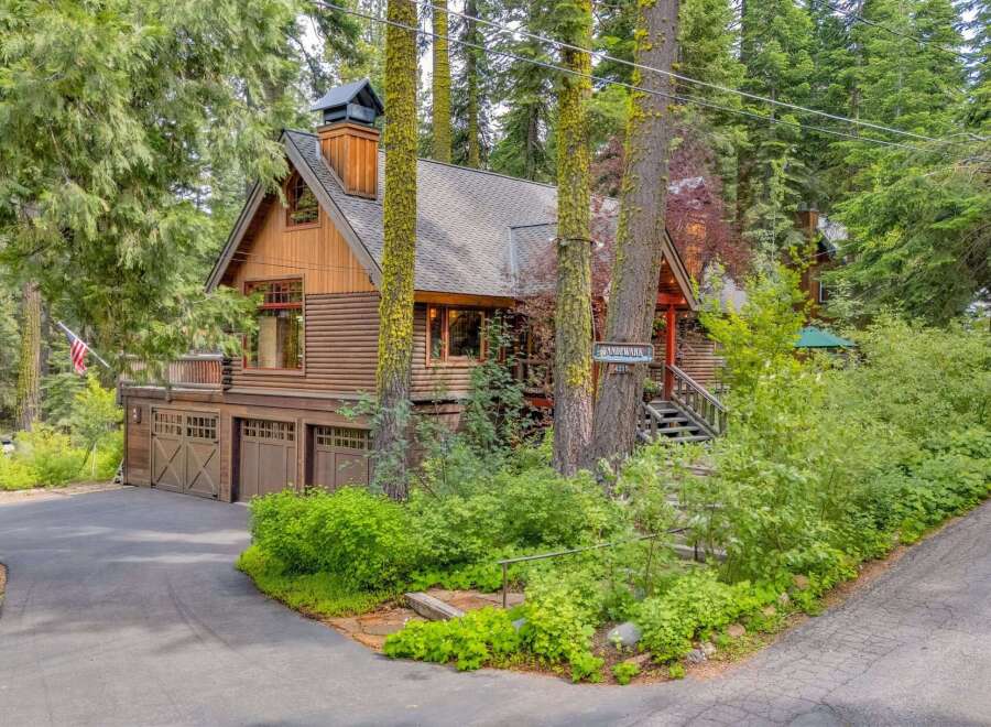 Nestled amidst towering trees, this charming log cabin offers a serene mountain retreat.