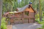 Experience rustic charm in this stunning log cabin nestled amongst tall pine trees.