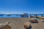 Enjoy lakeside living with this stunning property featuring a private dock and beach access.