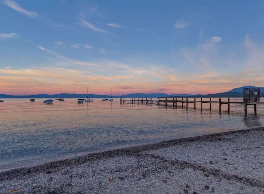 Experience serene lakefront living with this stunning property, featuring a private dock perfect for your boats and watercraft.
