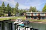 Enjoy waterfront living with this stunning property featuring a private dock and boat slips, perfect for water enthusiasts.