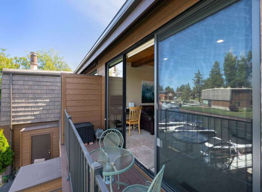 Enjoy stunning waterfront views from this charming balcony, perfect for morning coffee or evening relaxation.