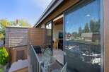 Enjoy stunning waterfront views from this charming balcony, perfect for morning coffee or evening relaxation.