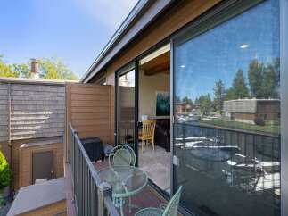 Enjoy stunning waterfront views from this charming balcony, perfect for morning coffee or evening relaxation.