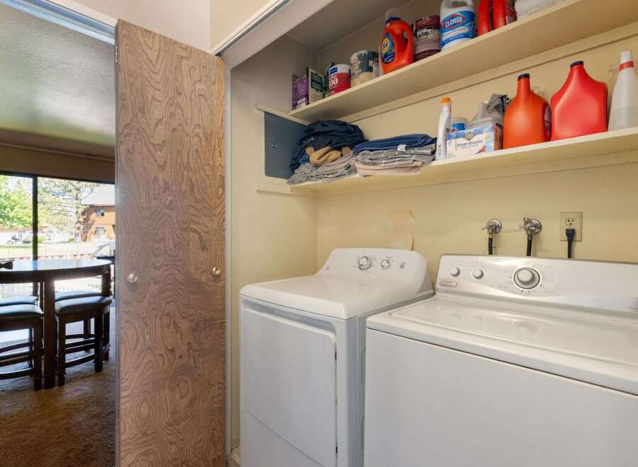 Discover convenience with this in-unit laundry space, featuring a stacked washer and dryer.