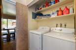 Discover convenience with this in-unit laundry space, featuring a stacked washer and dryer.