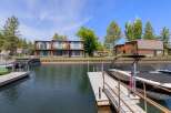 Enjoy waterfront living with this stunning property featuring private docks and boat slips, perfect for water enthusiasts.