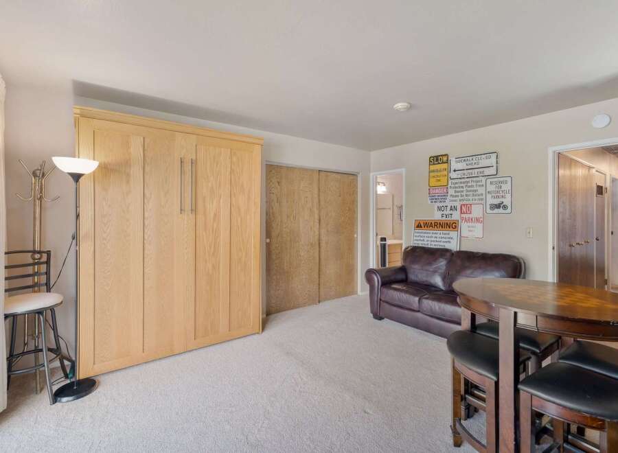 This versatile room features a space-saving Murphy bed, perfect for maximizing living area.