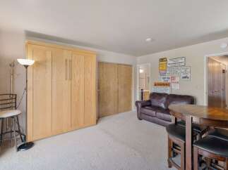 This versatile room features a space-saving Murphy bed, perfect for maximizing living area.