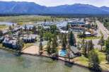 Experience lakeside living at its finest with this stunning aerial view of a resort-style property.