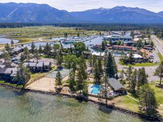 Experience lakeside living at its finest with this stunning aerial view of a resort-style property.