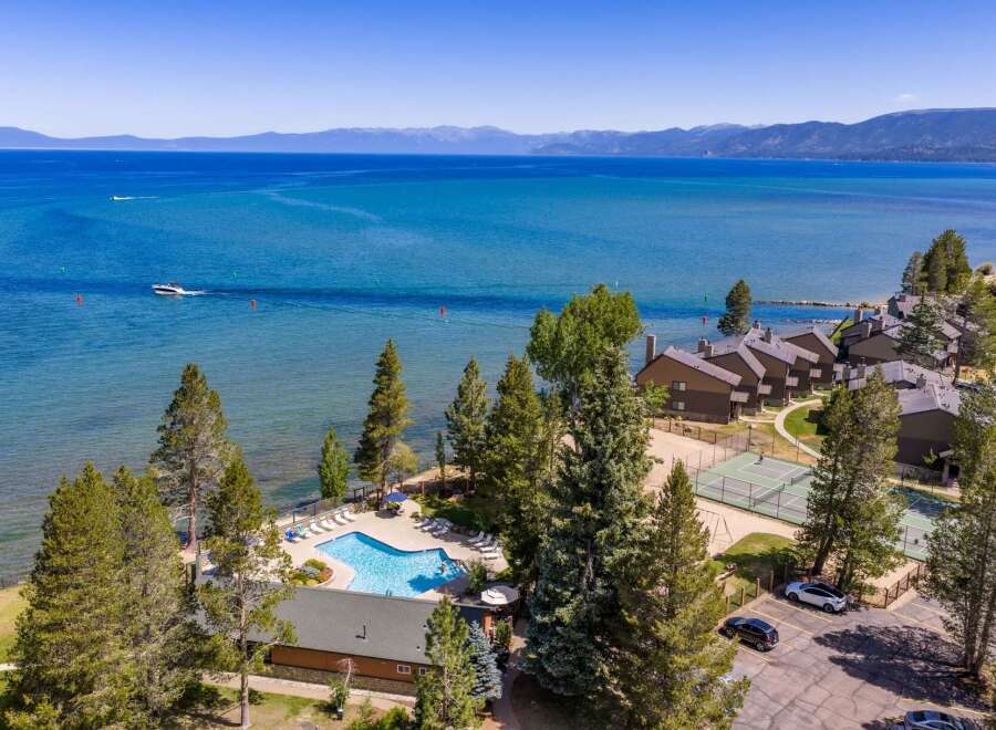 Experience lakeside luxury with this stunning aerial view of a resort property.
