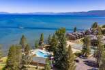 Experience lakeside luxury with this stunning aerial view of a resort property.