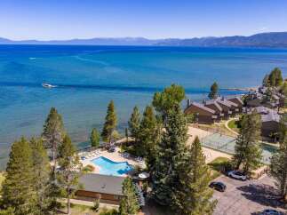 Experience lakeside luxury with this stunning aerial view of a resort property.